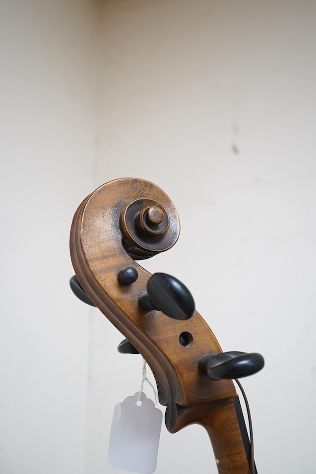 A late 19th century small cello, unsigned and without label inside body, stamped inventory number 769, length of back 62cm. Condition - poor to fair